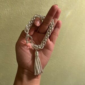 Thick silver bracelet with tassel